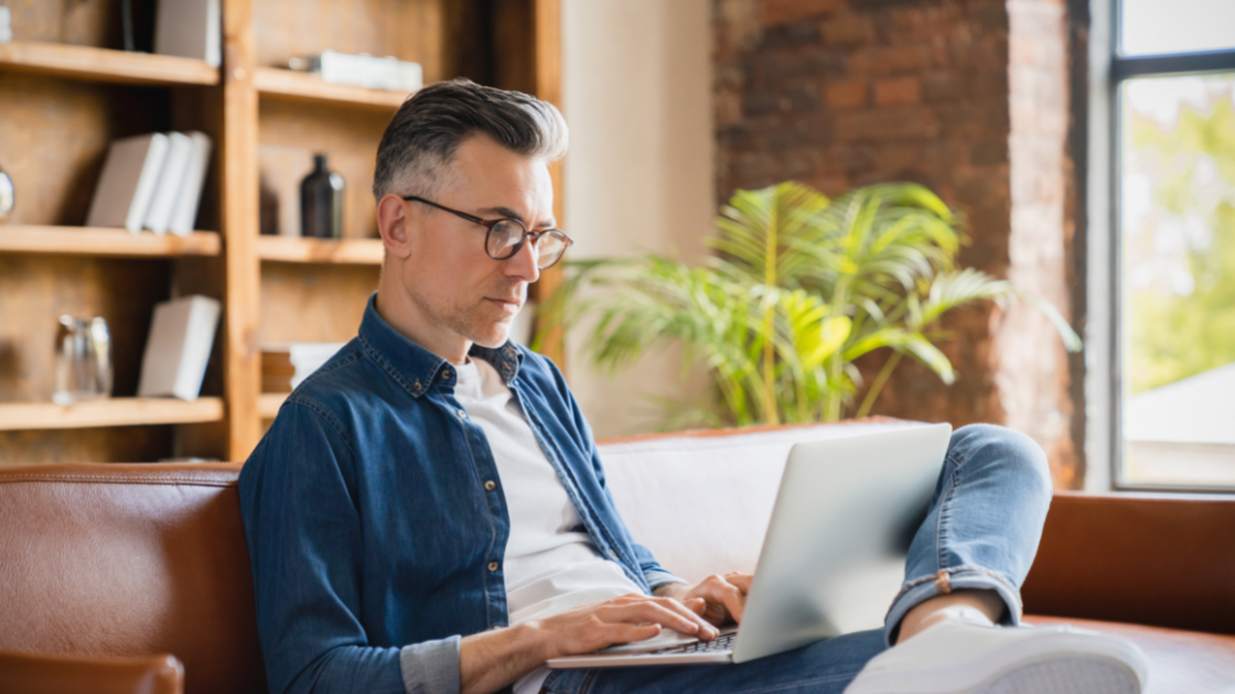 Man looking at guide to music licensing on computer