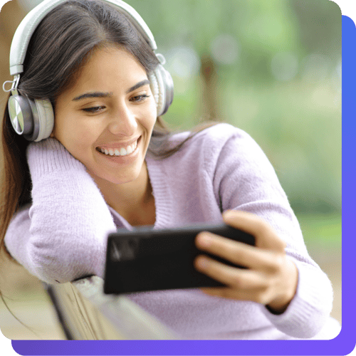 girl on her phone while selecting music for the ecards app