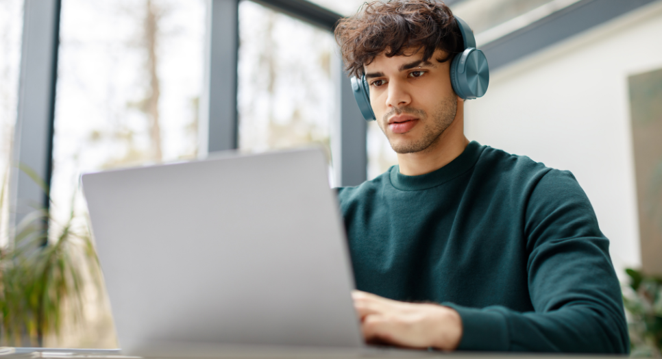 Man researching music licensing on computer work