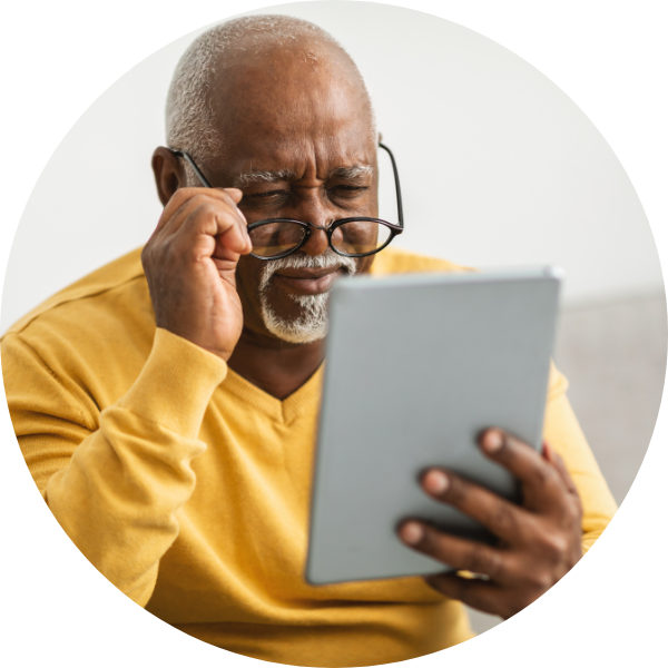 Senior man in telehealth appointment on tablet
