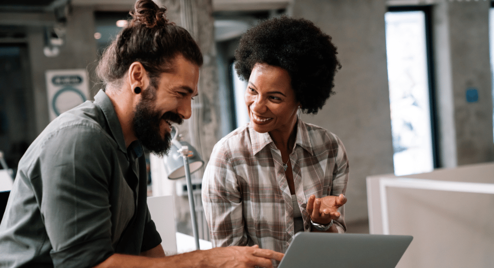 two people working on music-led growth at a company