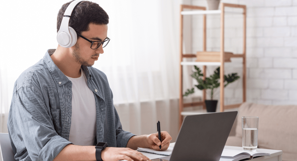 man listening to focus music on headphones