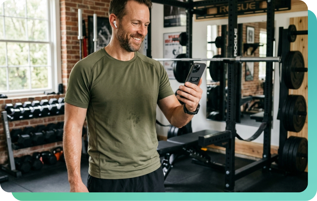 Man listening to music on wireless earbuds during a home gym workout