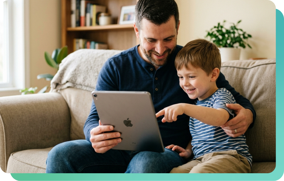 Father and son using a family app with licensed music on a tablet