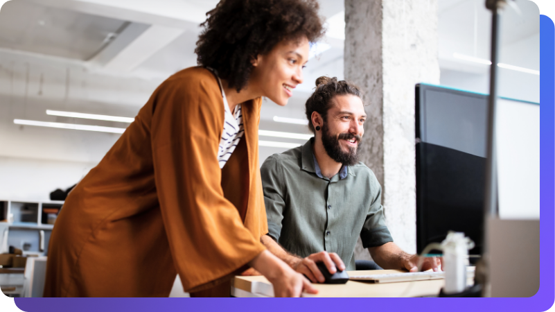 Man and woman working together on desktop