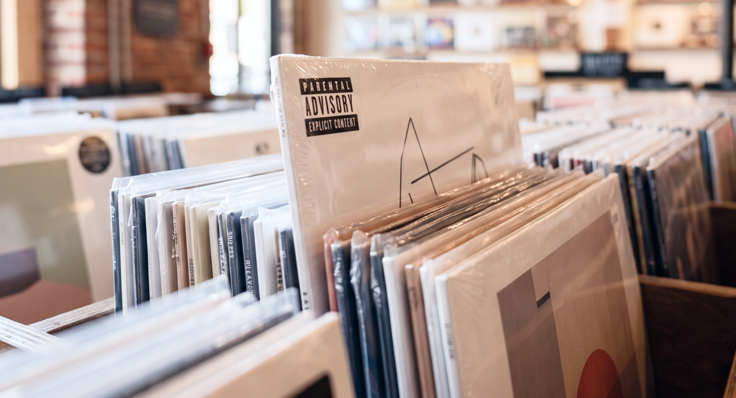 Parental Advisory sticker on record in a bin. music rating systems