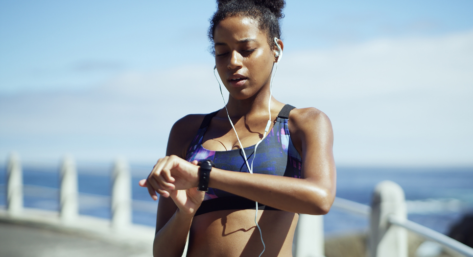 Woman exercising with AI trainer using smart watch.png