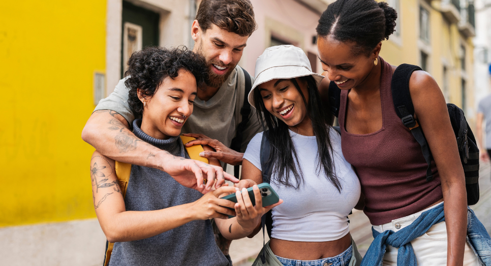 a group of friends looking at their phone 