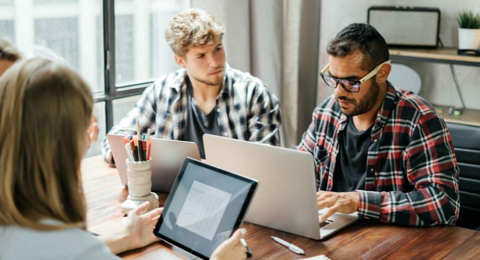 business team researching music licensing for social media apps